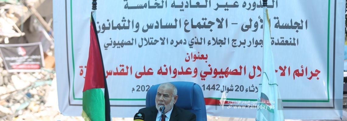 بالصور:جلسة للمجلس التشريعي على ركام برج الجلاء بغزة