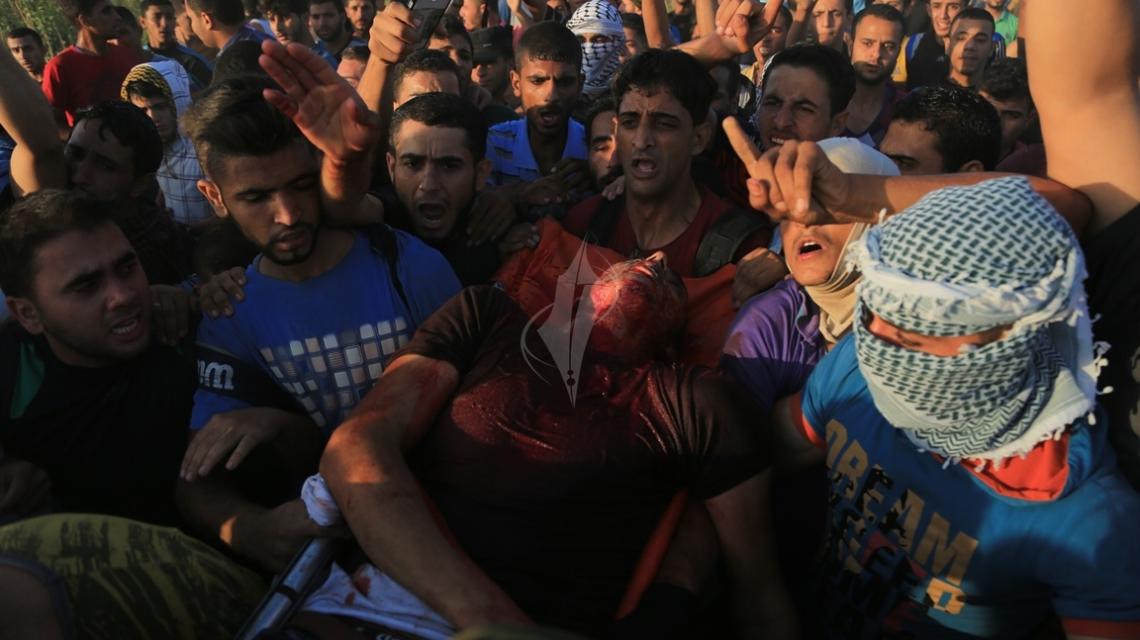 بالصور:"جمعة الغضب" شهداء وجرحى قرب معبر ناحال عوز"تصوير داوودأبو الكاس"