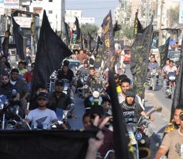 بالصور: حركة الجهاد بمدينة رفح تخرج بمسيرة دراجات نارية بذكرى إستشهاد الدكتور فتحى الشقاقى