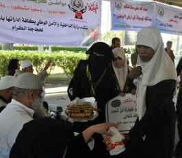  « sos »بالصور: العمل النسائي للجهاد الاسلامي يستقبل الحجاج على معبر رفح ويزور قرية الايتام