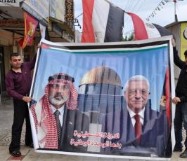 بالصور: فلسطينيون يعبرون عن فرحتهم بانهاء الانقسام بالصور والمجسمات