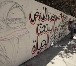رسم جداريات  امام برج الجوهرة  الذي قصفه الاحتلال بغزة (12)