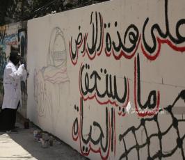 رسم جداريات  امام برج الجوهرة  الذي قصفه الاحتلال بغزة (5)