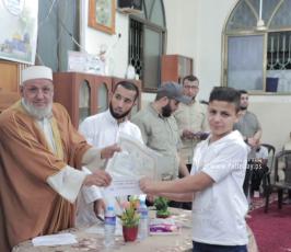الجهاد وجمعية اقرأ بشرق غزة تكرم كوكبة من حفظة أجزاء من القرآن الكريم  فو (6)