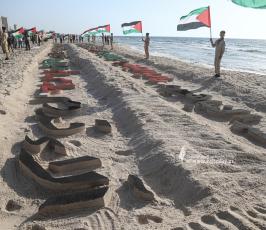  افتتاح أكبر منحوتة رملية في فلسطين بطول 100 متر تتضمن أسماء الشهداء الأطفال في معركة وحدة الساحات (4)