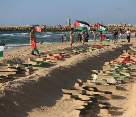  افتتاح أكبر منحوتة رملية في فلسطين بطول 100 متر تتضمن أسماء الشهداء الأطفال في معركة وحدة الساحات (14)