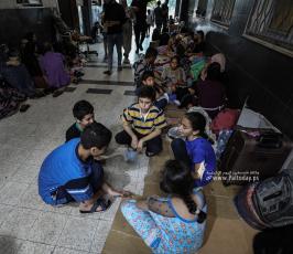  نزوح الآلاف من الفلسطينيين إلى مجمع الشفاء الطبي خوفا من القصف الإسرائيلي (12)
