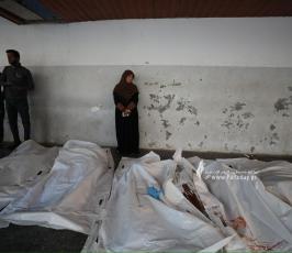 وداع شهداء بقف إسرائيلي في غزة