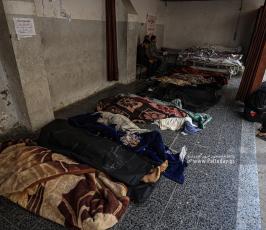 وداع حزين في المشفى الأهلي لـ15 شهيد بعد قصف منازل بشمال قطاع غزة (5)