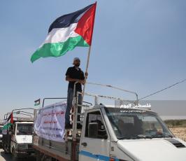 مسير للشاحنات يتوجه لمخيم ملكة شرق غزة رفضاً للحصار ‫(39256585)‬ ‫‬.JPG