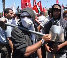 بالصور:في فلسطين.. العمال يحتفلون بيومهم العالمي على طريقتهم الخاصة
