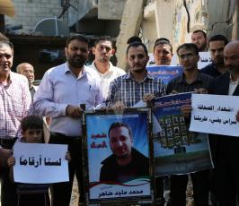 وقفة تضامن مع شهداء الصحافة على ركام منزل الشهيد الصحفى محمد ضاهر فى الذكرى الاولى لعدوان ‫(30700959)‬ ‫‬