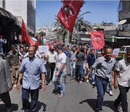 بالصور:في فلسطين.. العمال يحتفلون بيومهم العالمي على طريقتهم الخاصة