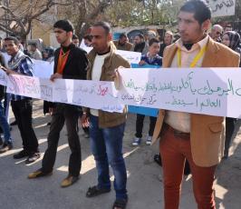 وقفة تضامنية بغزة مع اللاجئين الفلسطينيين في مخيم اليرموك في سوريا