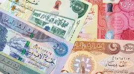 سعر الدينار العراقي يرتفع أمام الدولار الأمريكي