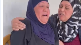 والدة الشهيد.PNG