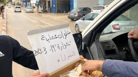 بالصور توزيع الحلوى ابتهاجاً بعملية إطلاق النار في حوارة