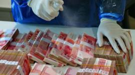 فيروس كورونا هل ينتقل عبر العملات