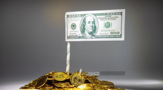تعبيرية" الدولار والذهب"