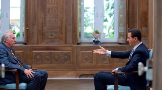 الرئيس السوري بشار الأسد خلال مقابلة مع وكالة الانباء الفرنسية