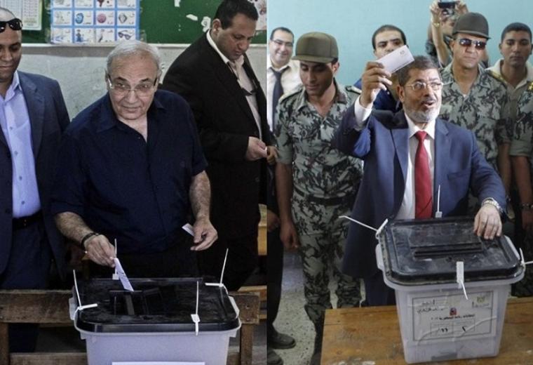 المتنافسان مرسي وشفيق يدليان بصوتيهما 