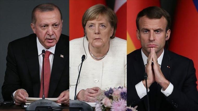 الرئيس التركي رجب طيب أردوغان ونظيره الفرنسي إيمانويل ماكرون والمستشارة الألمانية أنجيلا ميركل